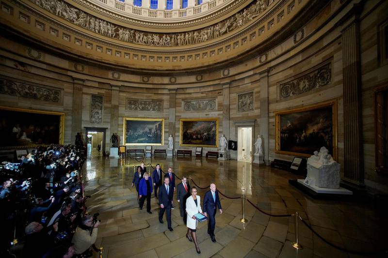 House Sergeant at Arms Paul Irving and House Clerk Cheryl Johnson carry two articles of impeachment against US President Donald Trump during a procession with the seven House impeachment managers through the Rotunda of the US Capitol to the US Senate on January 15, 2020. Reuters