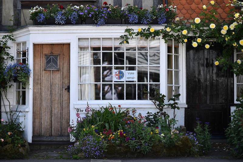 A ‘Vote Remain’ sign is posted on a window a house near Charing, south east of London. Ben Stansall / AFP