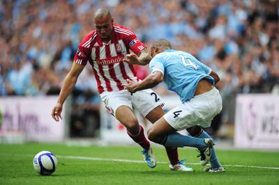 LONDON, ENGLAND - MAY 14: John Carew (L) of Stoke City takes on Vincent Kompany (R) of Manchester City during the FA Cup sponsored by E.ON Final match between Manchester City and Stoke City at Wembley Stadium on May 14, 2011 in London, England. (Photo by Shaun Botterill/Getty Images)
