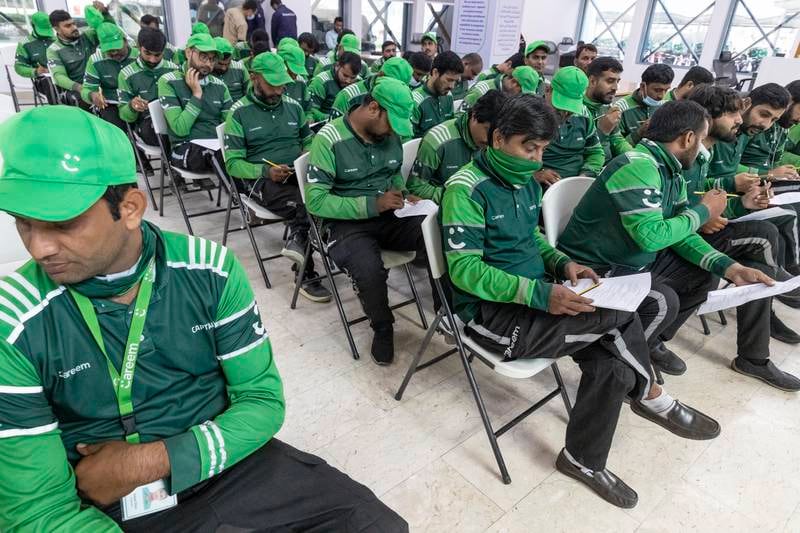 Careem workers take part in an awareness session organised by the 
Permanent Committee for Labour Affairs in Dubai. Antonie Robertson / The National
