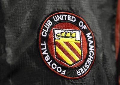 The FC United of Manchester badge, displayed on a warm-up jacket. Phil Noble / Reuters
