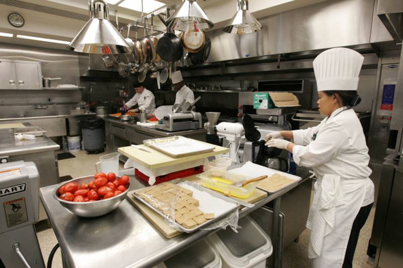 Comerford and staff work in the Kitchen of the White House in 2009. Official White House Photo / Joyce N Boghosian