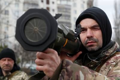 A new member of the Territorial Defence Forces trains to operate an AT4 anti-tank launcher in Kyiv. Reuters