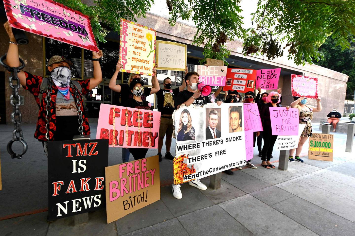 (FILES) In this file photo taken on September 16, 2020 Supporters of Britney Spears end the conservatorship court case attend the #FreeBritney Protest outside Los Angeles Courthouse at Stanley Mosk Courthouse on in Los Angeles, California. the legal agreement barring Britney Spears from managing her own life and finances is now older than the pop star was when the public met her as an effervescent 12-year-old on the Disney Channel -- and controversy over who steers her life is starting to boil. Spears, 39, has lived under the strict arrangement since her infamous unraveling, which in 2008 led a California court to place her under a unique legal guardianship largely governed by her father, Jamie. / AFP / GETTY IMAGES NORTH AMERICA / Frazer Harrison
