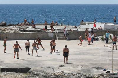 Beirut residents gather at a closed swimming club along the seaside corniche.  AFP