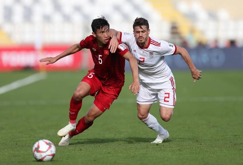 Vorya Ghafouri ,right, of Iran in action against Doan Van Hau of Vietnam during the 2019 Asian Cup Group D match at Al Nahyan Stadium in Abu Dhabi. EPA