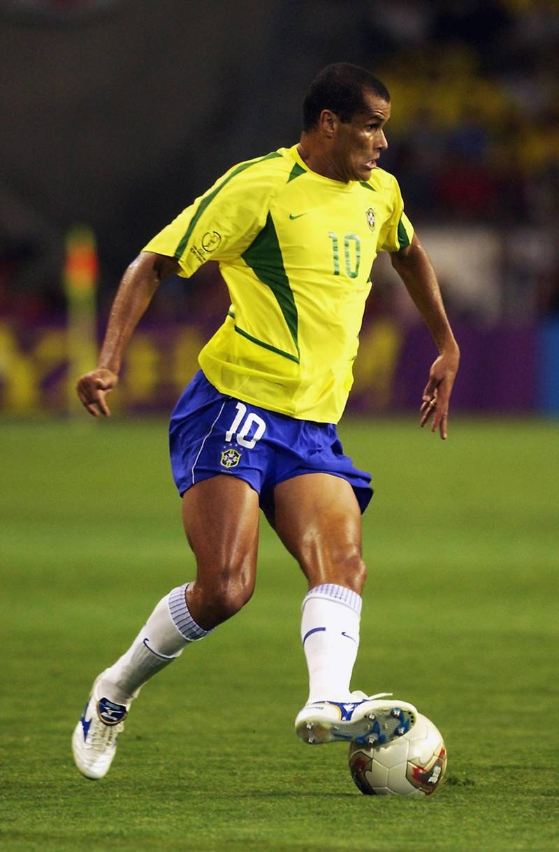 KOBE - JUNE 17:  Rivaldo of Brazil runs with the ball during the FIFA World Cup Finals 2002 Second Round match between Brazil and Belgium played at the Kobe Wing Stadium, in Kobe, Japan on June 17, 2002. Brazil won the match 2-0. DIGITAL IMAGE. (Photo by Ross Kinnaird/Getty Images)
