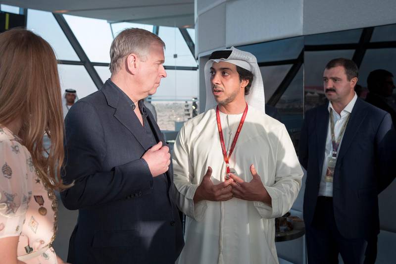 YAS ISLAND, ABU DHABI, UNITED ARAB EMIRATES - November 27, 2016: HH Sheikh Mansour bin Zayed Al Nahyan, UAE Deputy Prime Minister and Minister of Presidential Affairs (C) speaks with HRH Prince Andrew Duke of York (L) during the final day of the 2016 Formula 1 Etihad Airways Abu Dhabi Grand Prix, at Shams Tower. Seen with HE Viktor Lukashenko Special Advisor to President of Belarus (back R).( Ryan Carter / Crown Prince Court - Abu Dhabi )— *** Local Caption ***  20161127RC_C163287.jpg