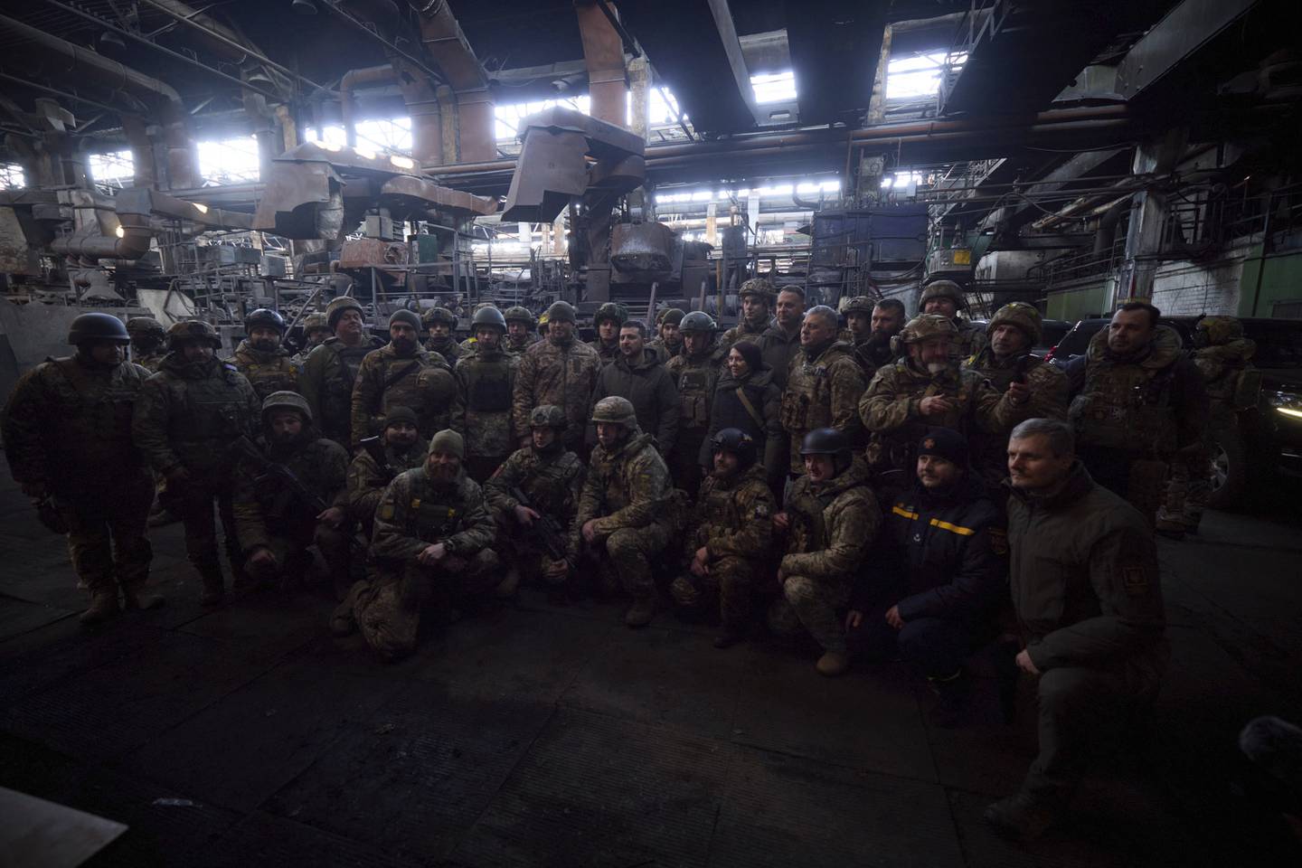 Ukrainian President Volodymyr Zelenskyy poses with soldiers at Bakhmut, Ukraine, on Tuesday. AP