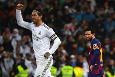 Barcelona's Argentine forward Lionel Messi reacts as Real Madrid's Spanish defender Sergio Ramos celebrates his team's second goal. AFP
