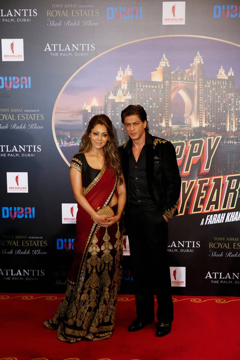 DUBAI, UNITED ARAB EMIRATES, OCTOBER 22, 2014. Shah Rukh Khan and his wife Gauri Khan on the red carpet at the premier of the Bollywood movie Happy New Year at Atlantis, The Palm.  (Photo: Antonie Robertson/The National) Journalist: Melanie Swan. Section: Arts & Life.