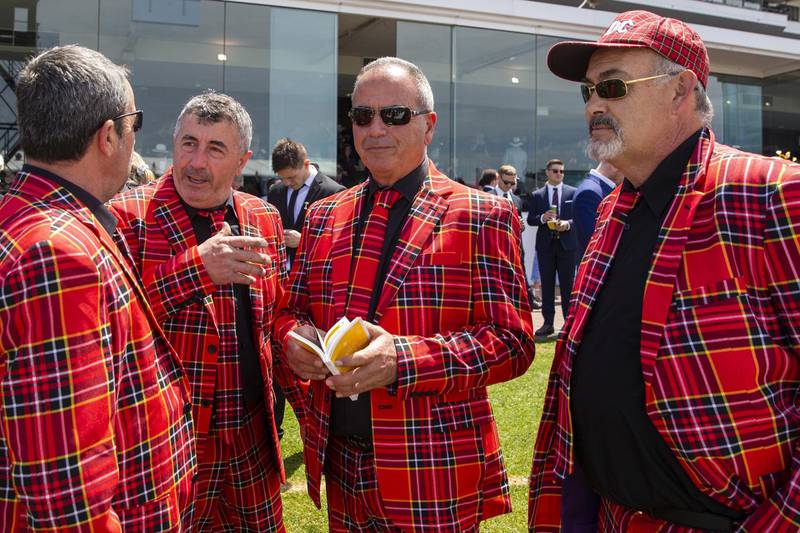 Men in tartan suits are seen during 2019 Melbourne Cup Day at Flemington Racecourse. Getty Images