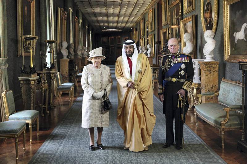 WINDSOR, ENGLAND - APRIL 30:  Queen Elizabeth II (L) and Prince Philip, Duke of Edinburgh (R), greet The President of the United Arab Emirates, His Highness Sheikh Khalifa bin Zayed Al Nahyan (C), in Windsor Castle on April 30, 2013 in Windsor, England. The President of the United Arab Emirates is paying a two-day State Visit to the United Kingdom, staying in Windsor Castle as the guest of Her Majesty The Queen from April 30, 2013 to May 1, 2013. Sheikh Khalifa will meet the British Prime Minister David Cameron tomorrow at his Downing Street residence.  (Photo by Oli Scarff/Getty Images)