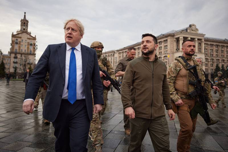 Mr Johnson and Ukrainian President Volodymyr Zelenskyy walking in central Kyiv, in April. AFP