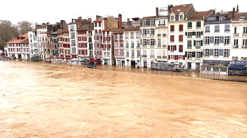 River Nive overflows into the streets of Bayonne in France. Global warming, unpredictable weather and pandemic is threating the social and political fiber across globe. Reuters