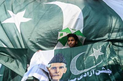 A trader sells national flags in Lahore. AFP