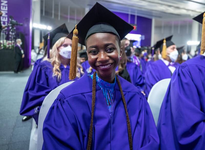 Price Maccarthy, 22, from Ghana, graduated from NYUAD on Monday. She looks jubilant in her graduation robe and hat at the commencement ceremony. All photos: Victor Besa / The National