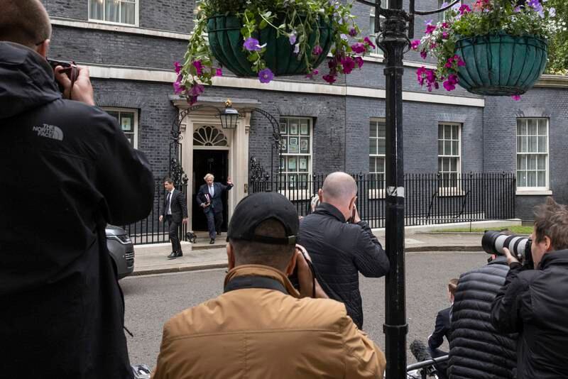 Photographers surround No 10 Downing Street as Mr Johnson departs for the Prime Minister's Questions session in the House of Commons, on Wednesday morning. Getty Images