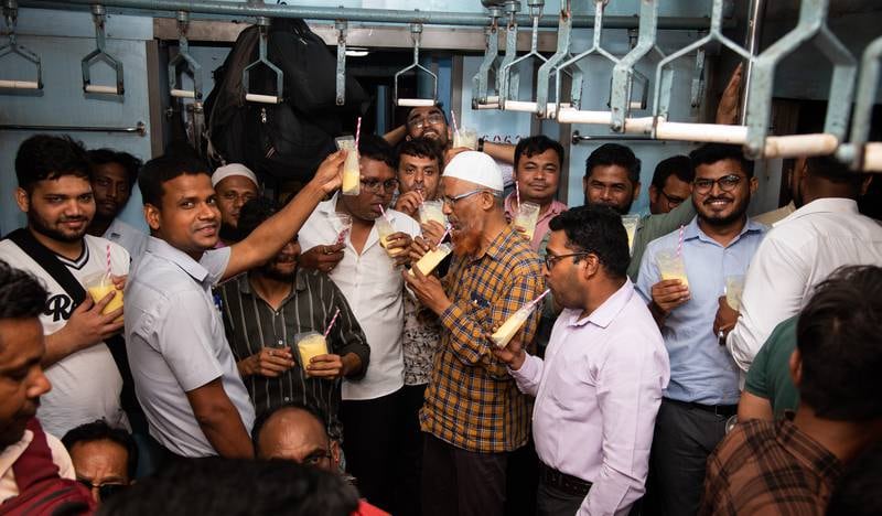 The friends enjoy piyush - a rich, sweet yogurt-based drink popular in India's Maharashtra state - after iftar