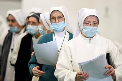 Nuns wait to receive the coronavirus disease vaccine in Bergamo, Italy. Reuters