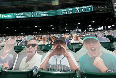 Photos of Seattle Mariners fans cheering are shown in the stands of T-Mobile Park during the ninth inning of the Mariners' final home baseball game of the regular season in Seattle. AP Photo