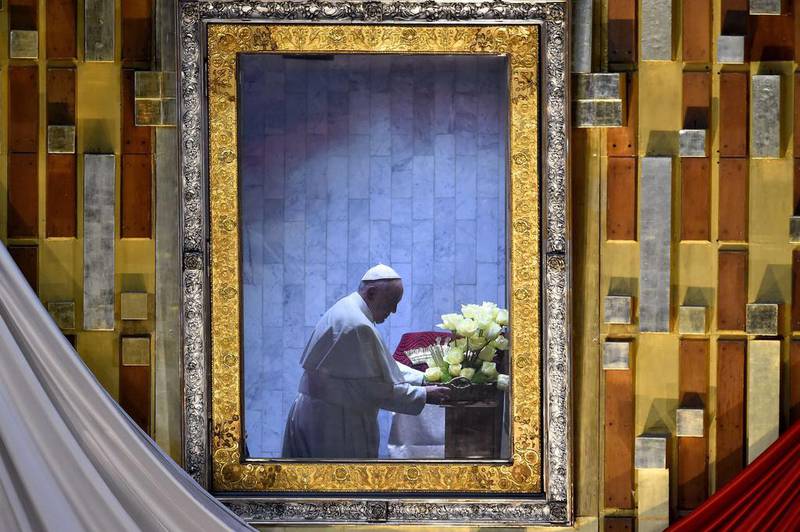 Pope Francis prays in the Basilica of Our Lady of Guadalupe in Mexico City last month. The pope expressed contrition for the church's role in the Spanish conquest of the Americas. AFP