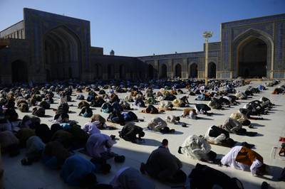 Devotees offer Eid Al Fitr prayers at the Jami mosque, in Herat, Afghanistan. AFP