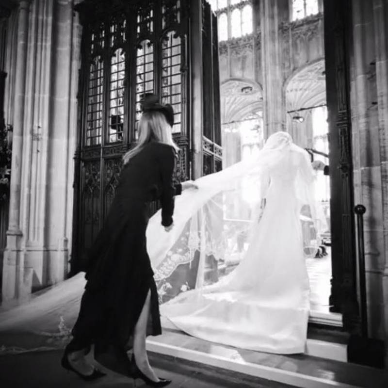 Givenchy's Clare Waight Keller arranges the Duchess of Sussex's veil. Instagram / Sussex Royal