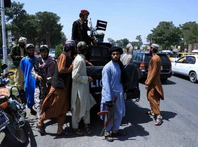 Taliban forces patrol a street in Herat.