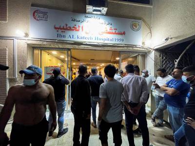 People gather at Ibn Al Khateeb hospital after a fire caused by an oxygen tank explosion. Reuters