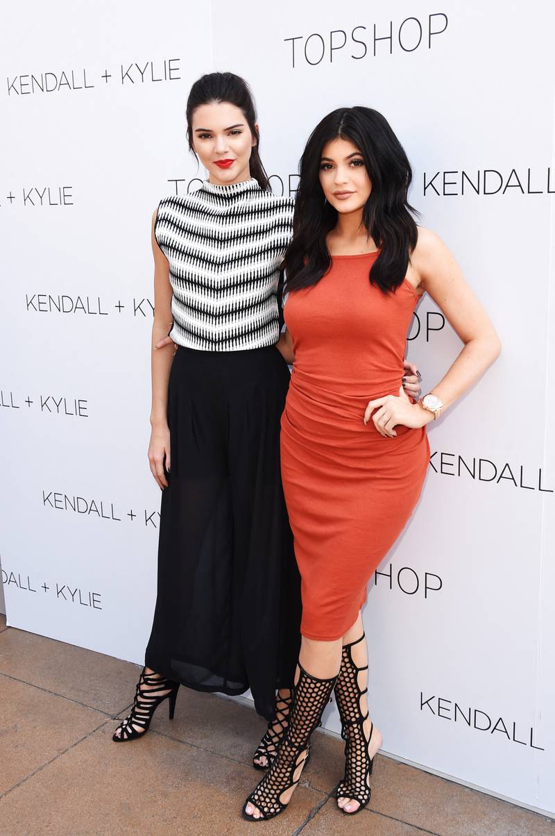 Kendall Jenner and Kylie Jenner, in a Topshop dress, attend a launch party for their Kendall + Kylie fashion line at Topshop on June 3, 2015 in Los Angeles, California. Getty Images