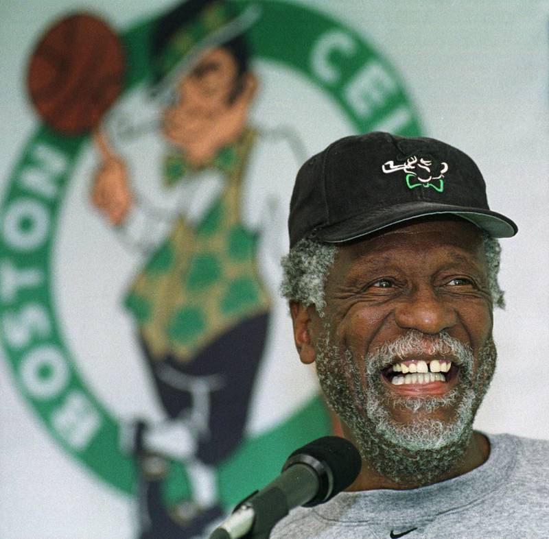Boston Celtics legendary center Bill Russell answering questions from members of the media after a Celtics team practice in 1999. AP