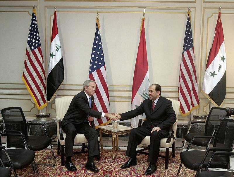 President George W Bush shakes hands with Iraqi Prime Minister Nuri Al Maliki during a meeting on June 13, 2006 in Baghdad. Getty