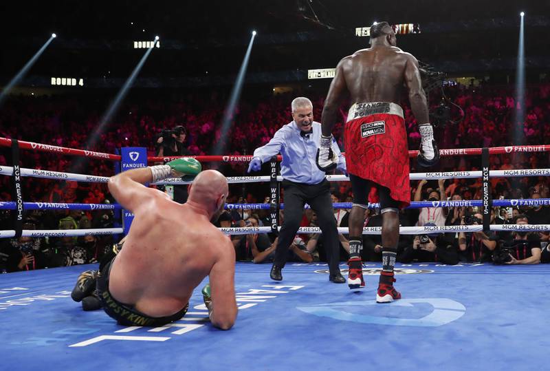 Deontay Wilder knocks down Tyson Fury in the fourth round. Reuters