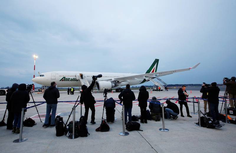 Members of the media wait for Pope Francis ahead of his arrival to board a plane for his visit to Iraq, at the Leonardo da Vinci-Fiumicino Airport in Rome, Italy, March 5, 2021. REUTERS/Remo Casilli