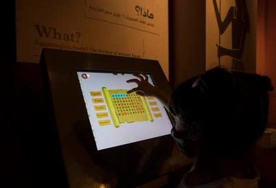 A child uses a touchscreen to learn about Ancient Egypt.