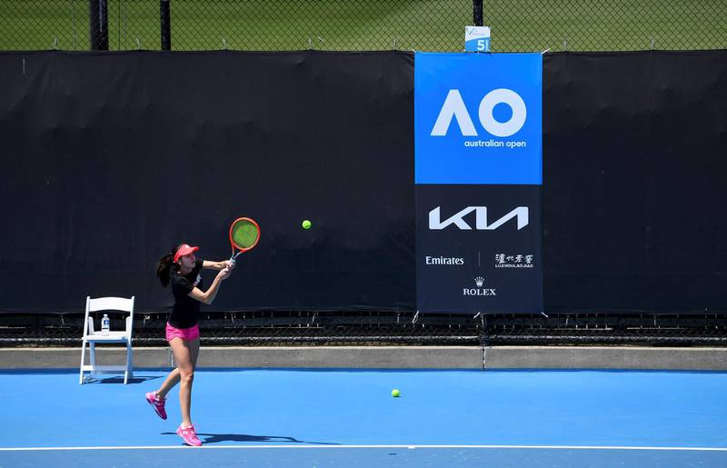 An unidentified tennis player hits a return during a practice session in Melbourne. AFP