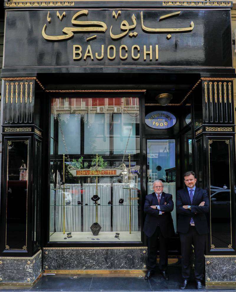 Pietro and his son Raul, owners of Bajocchi Jewellers, at the entrance of their shop. Reuters