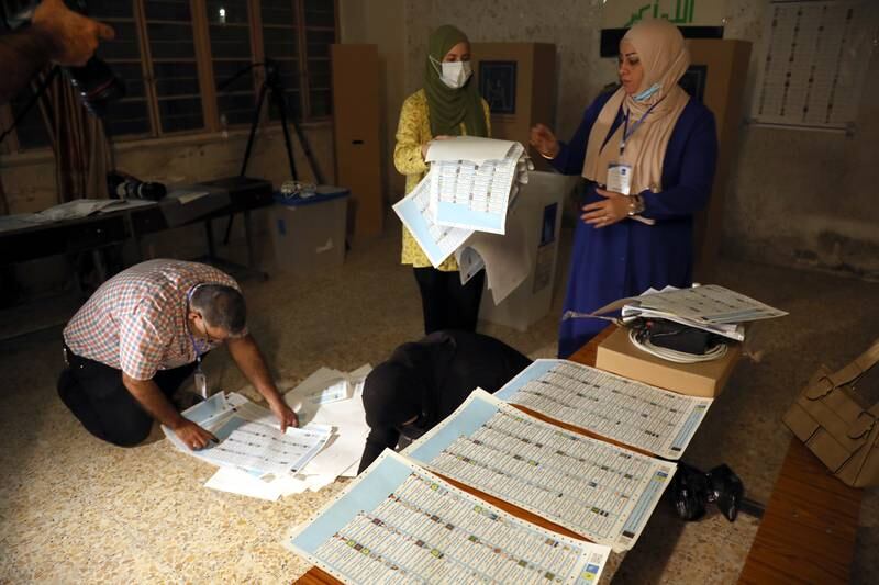 Iraqi election committee staff members count votes to elect 329 new members of the Council of Representatives. EPA