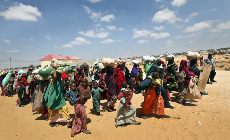 Families displaced by drought arrive at camps on the outskirts of Mogadishu, Somalia. Farah Warsameh / AP Photo