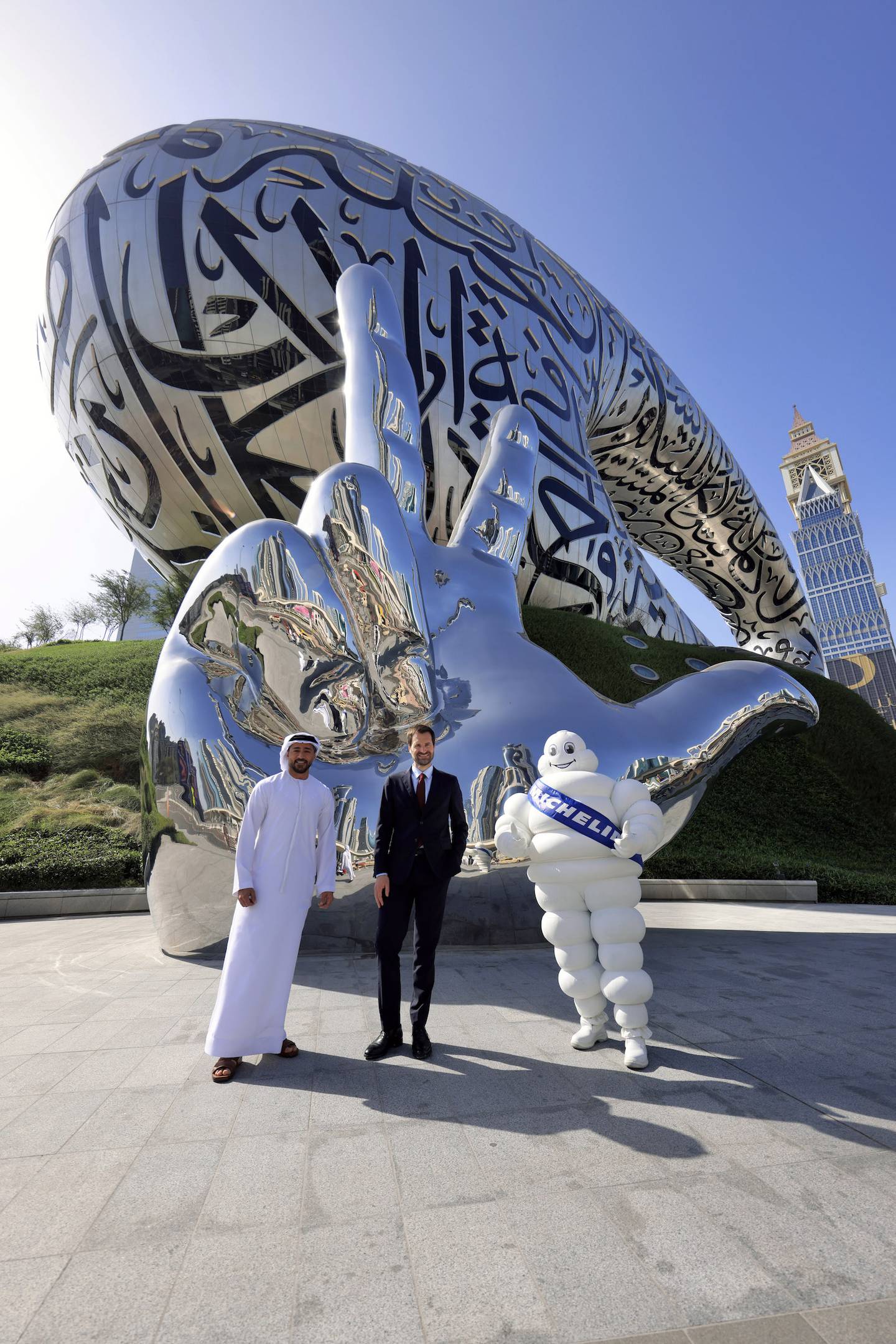 From left, Issam Kazim, chief executive of Dubai Corporation for Tourism and Commerce; Gwendal Poullennec, international director of the Michelin Guides; and Bibendum, the Michelin mascot, at the Museum of the Future, Dubai. Photo: Michelin