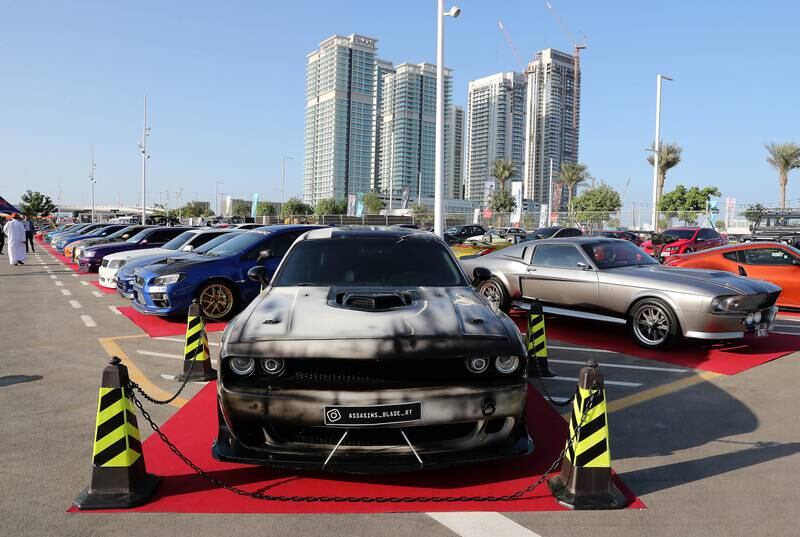 A customised Dodge Charger sits before Dubai Harbour's skyscrapers. Pawan Singh / The National