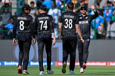 New Zealand's Tim Southee celebrates with teammates after taking the wicket of Pakistan's Abdullah Shafique. AFP