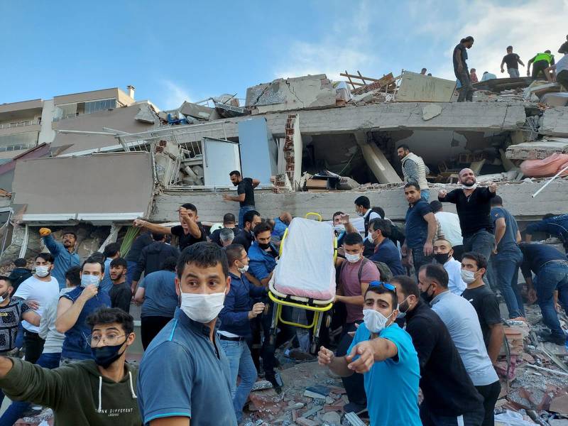 Locals and officials search for survivors at a collapsed building in Izmir, Turkey, after a strong earthquake struck the Aegean Sea. Reuters
