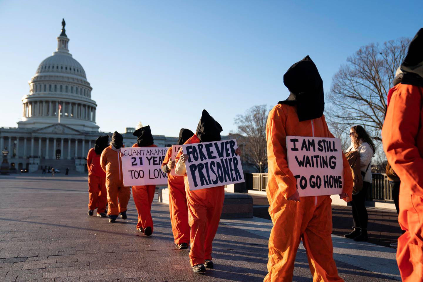 A group of people dressed as prisoners protest at the US Capitol. Reuters