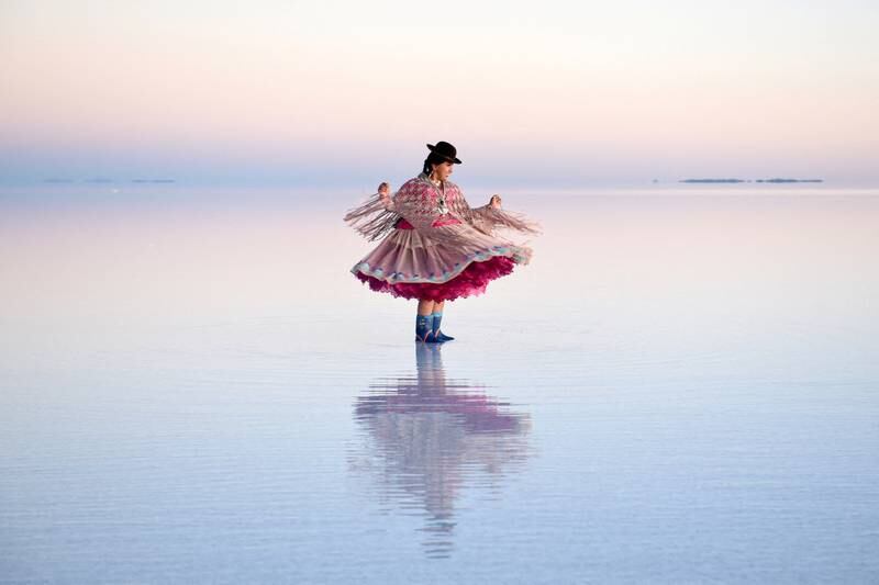 Striking a pose in a traditional Bolivian cholita dress at the Uyuni Salt Flat on March 26. Reuters