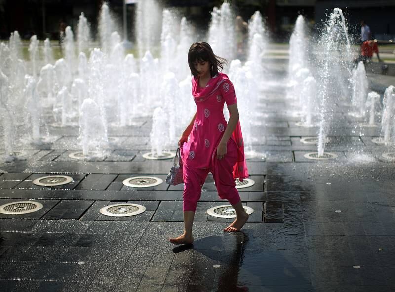A student cools off in the fountains of Piccadilly Gardens in  Manchester, in 2009.