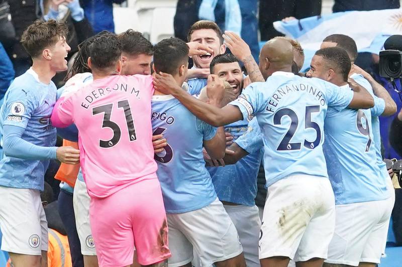 Manchester City's striker Sergio Aguero, centre, celebrates scoring the team's fourth goal against Everton in what was his last league match at the Etihad Stadium on Sunday, May 23, 2021. AFP