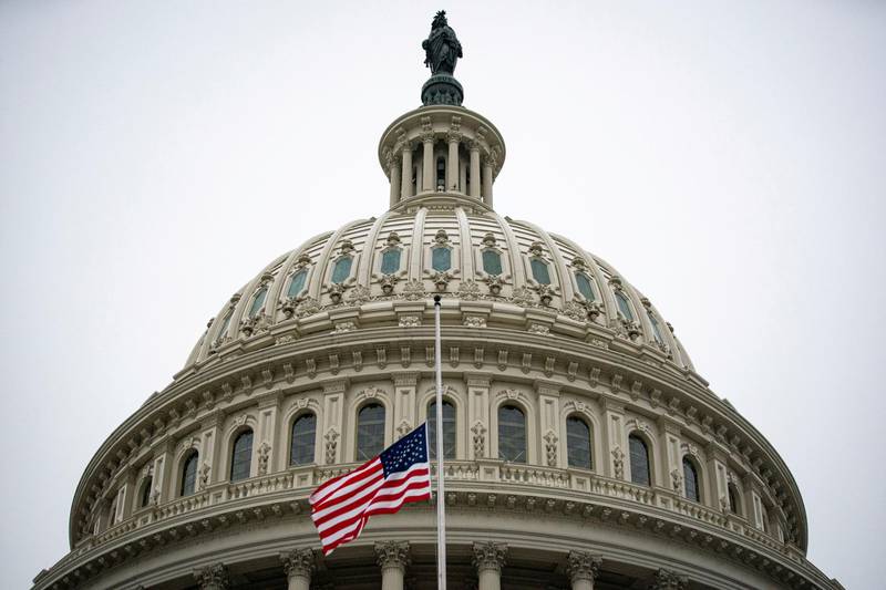 The American flag flies at half staff at the U.S. Capitol Building on the fifth day of the impeachment trial of former U.S. President Donald Trump, on charges of inciting the deadly attack on the U.S. Capitol, in Washington, U.S., February 13, 2021. REUTERS/Al Drago     TPX IMAGES OF THE DAY