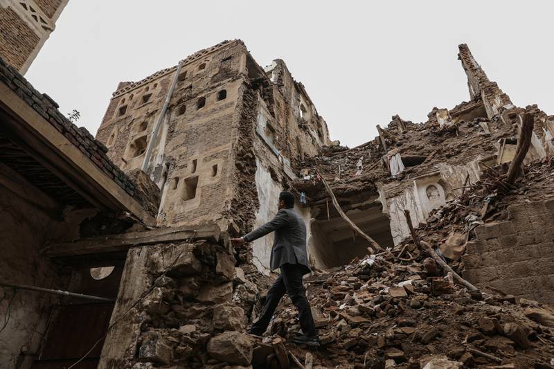 A man walks past a building collapsed by rain in the UNESCO World Heritage site of the old city of Sanaa, Yemen. REUTERS